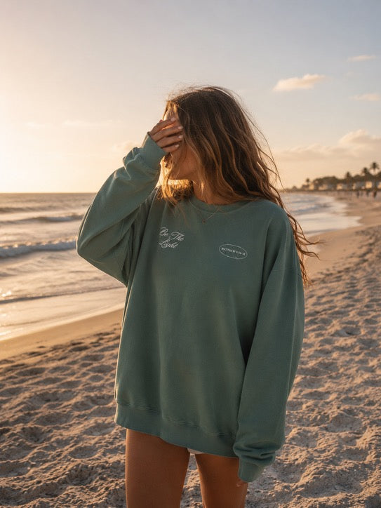 be the light lighthouse coastal crewneck